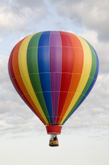 Naklejka premium Hot-Air Balloon Floating Among Clouds