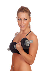 Attractive girl training with dumbbells