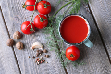 Naklejka na ściany i meble Homemade tomato juice in color mug, spices and fresh tomatoes