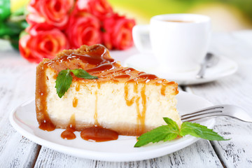 Cheese cake  in plate and tuft of roses