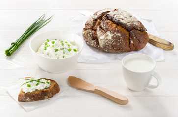 Breakfast including cottage cheese, bread and milk