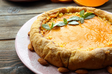 Homemade pumpkin pie on table
