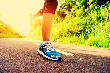 fitness woman runner running on  trail