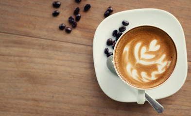 Cup of art latte or cappuccino coffee