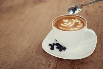 Cup of art latte or cappuccino coffee