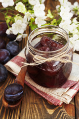 Plum jam in a glass jar