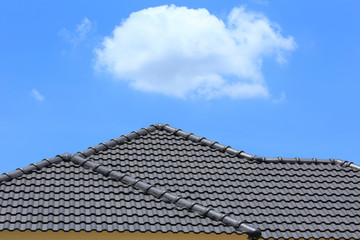 tile roof on a new house with blue sky