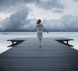 Conceptual photo of the lady on the jetty