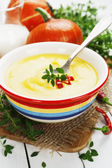 Spicy pumpkin soup with cream and chili pepper
