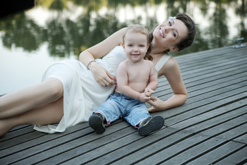 Brunette mother posing with her son