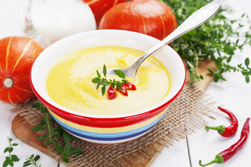 Spicy pumpkin soup with cream and chili pepper