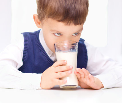 Cute Little Boy With A Glass Of Milk