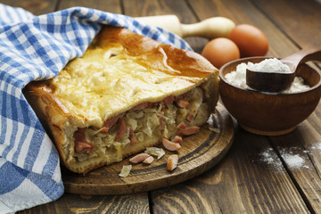 Pie with cabbage and sausages