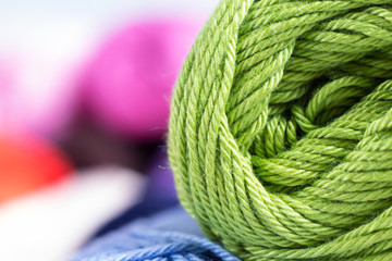 colors of yarn thread on white background 