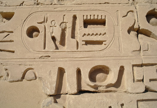 Egyptian images and hieroglyphs engraved on stone