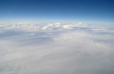 clouds and blue sky seen from plane