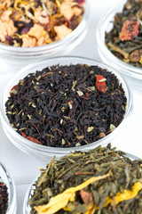 assortment of dry tea in glass bowls