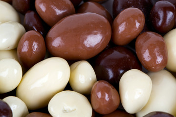 chocolate covered nuts and raisins background