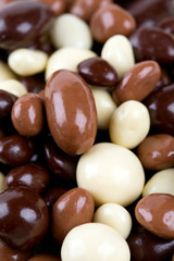 chocolate covered nuts and raisins background