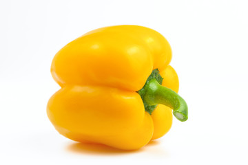 sweet yellow bell pepper on a white background illuminated