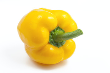 sweet yellow bell pepper on a white background illuminated