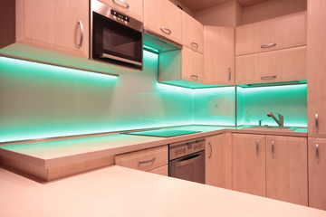 Modern luxury kitchen with green LED lighting