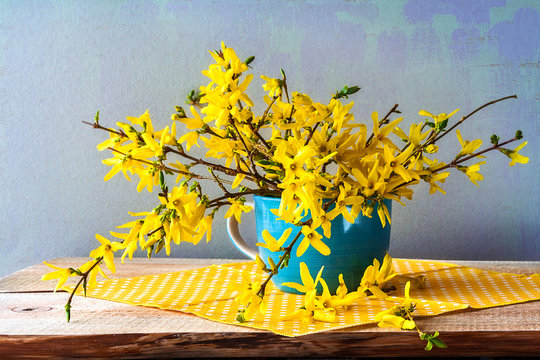 Still life spring bouquet yellow forsythia