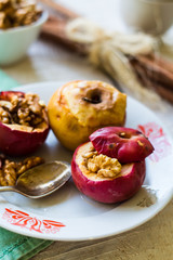 sweet baked apples with walnuts, cinnamon and honey,autumn