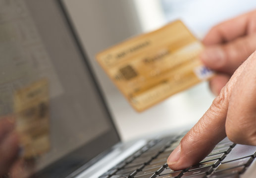 Man using tablet pc and credit card indoor, Shopping online