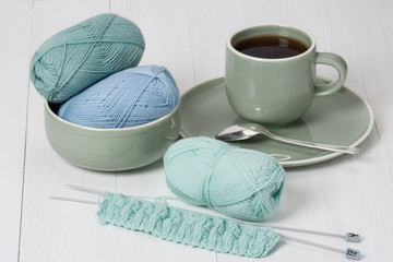 Knitting Accessories. Yarn Balls. Knit Needles. Cup Of Hot Drink