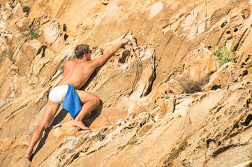 Young athletic man free climbing - Freedom extreme sports