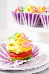 Rainbow colored muffin ready to eat