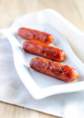 Roasted sausages on the plate
