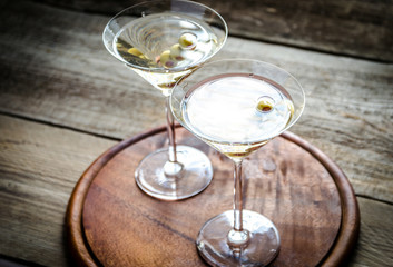 Two olive martini cocktails