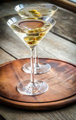 Two olive martini cocktails