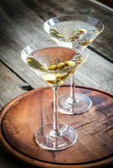 Two olive martini cocktails