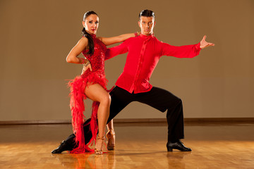 latino dance couple in action - dancing wild samba
