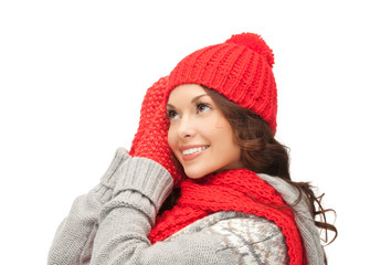 beautiful asian woman in hat, scarf and mittens