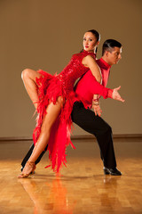 latino dance couple in action - dancing wild samba