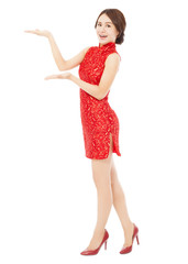 Naklejka premium pretty asian young woman with cheongsam standing.