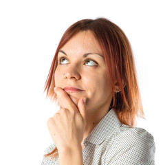 Fototapeta premium Girl thinking over isolated white background