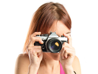 Girl photographing over white background