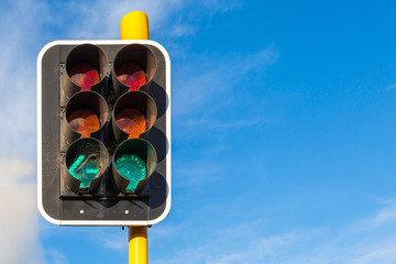 The grungy traffic lights with beautiful blue sky in backgrounds