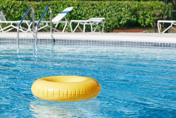 floating ring on blue water swimpool with waves reflecting - 71329182