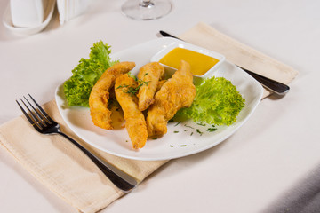 Plate of Chicken Fingers and Dipping Sauce