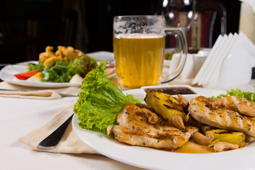 Appetizing Dishes and Beer Mug on Table