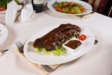 Plate of Ribs with Dipping Sauce at Place Setting