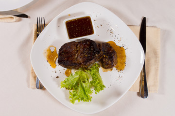 Overhead of Steak on Plate with Garnish
