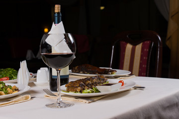 Glass of Red Wine on Table with Dinner