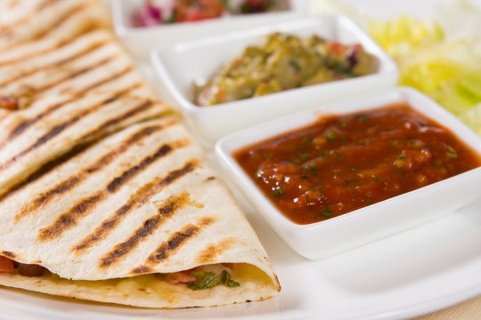 Close Up of Grilled Quesadilla with Salsas